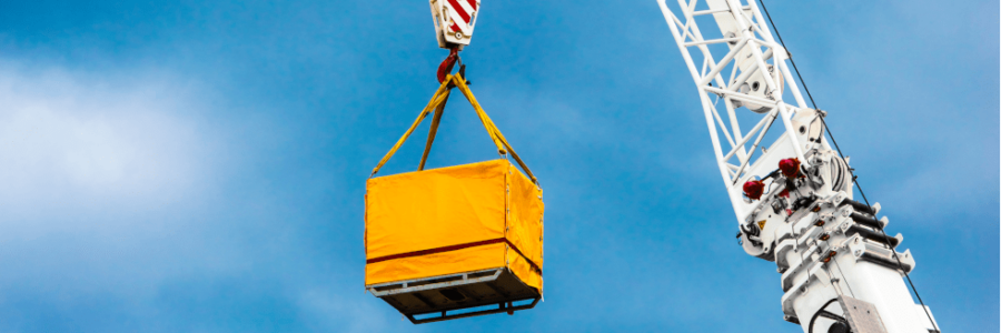 Crane lifting up sling of material